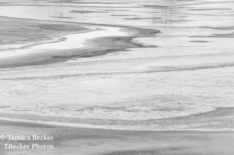 Ice and snow covered lake